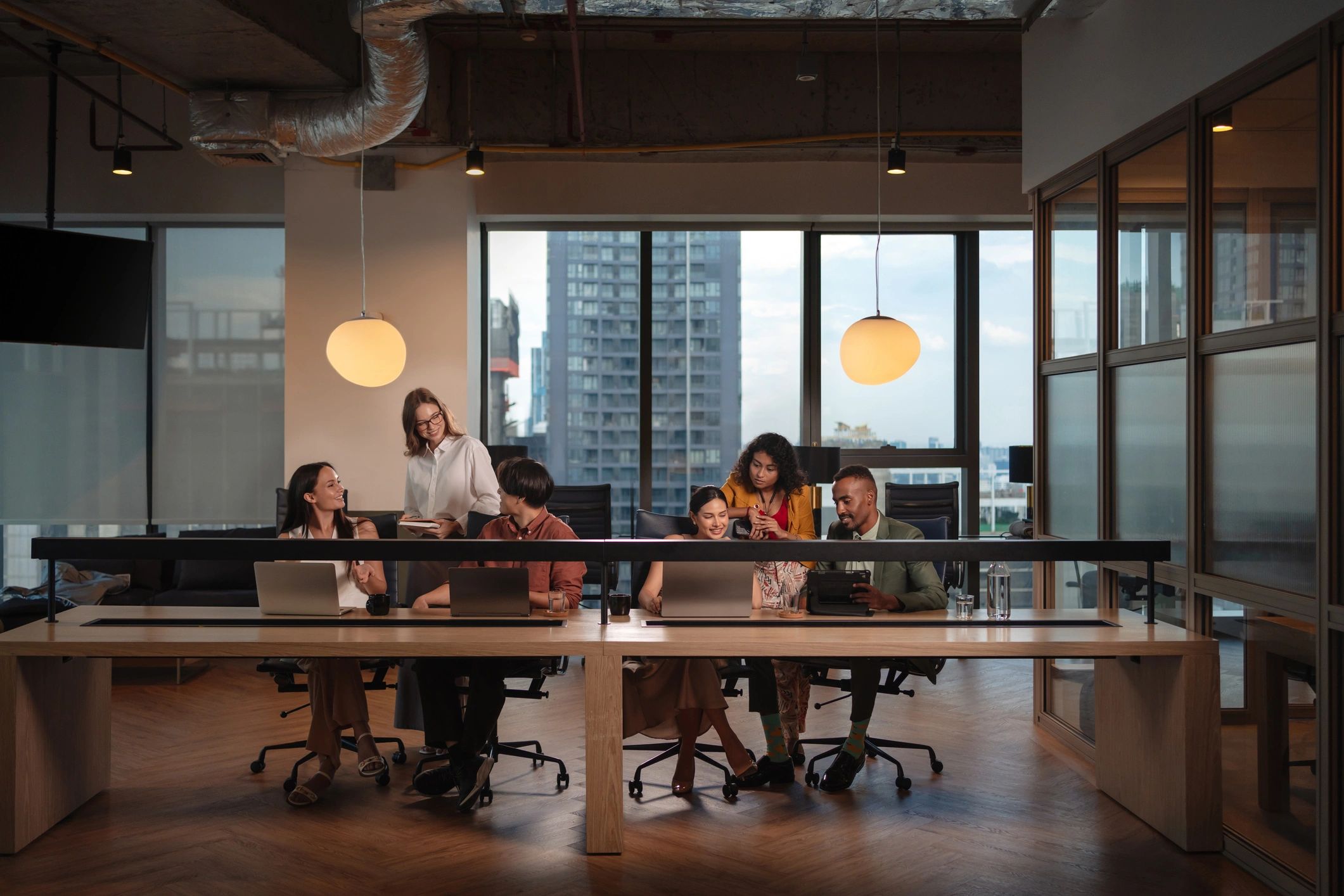 IT support team collaborating in a modern workspace