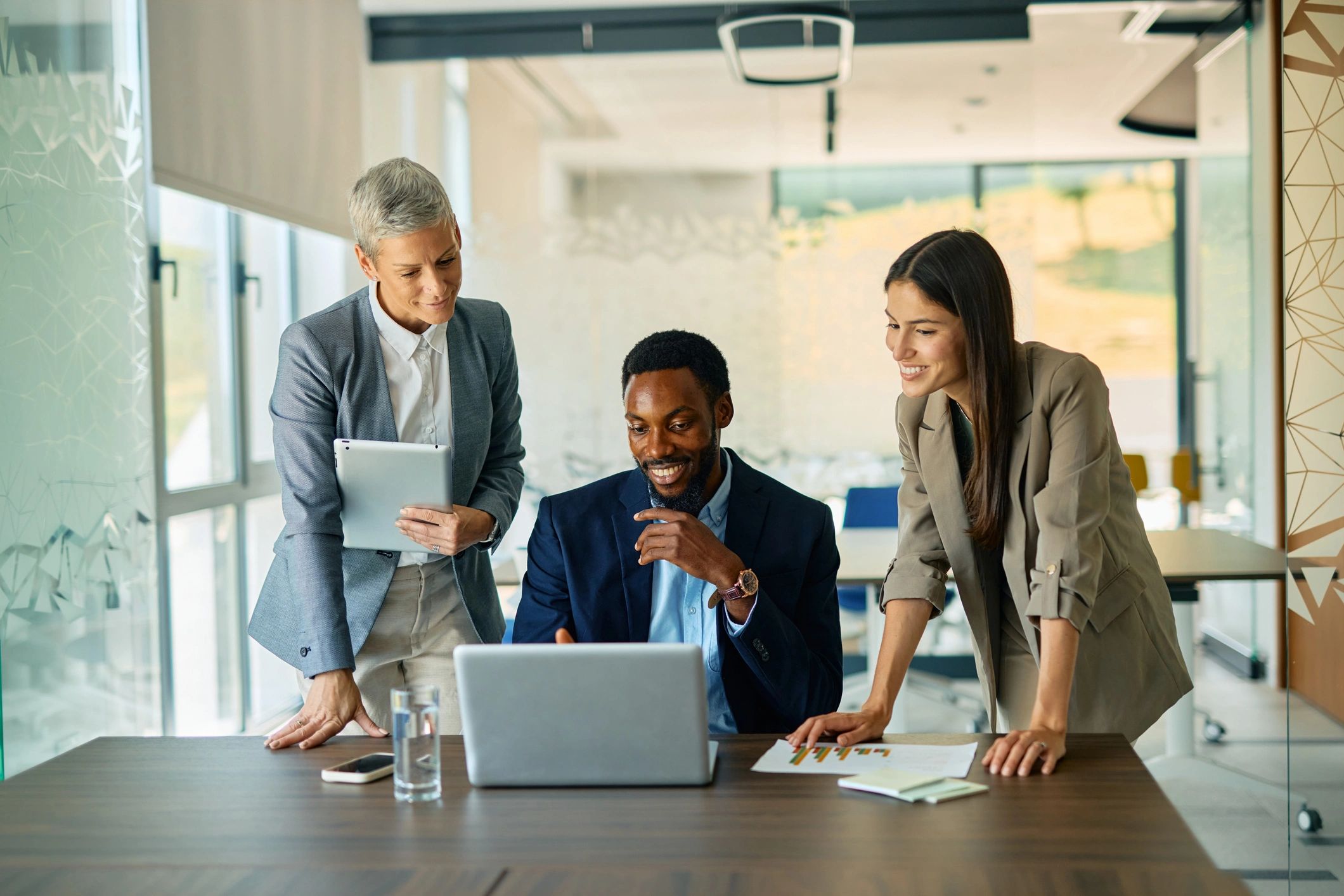 Business team collaborating on a website project in a modern office