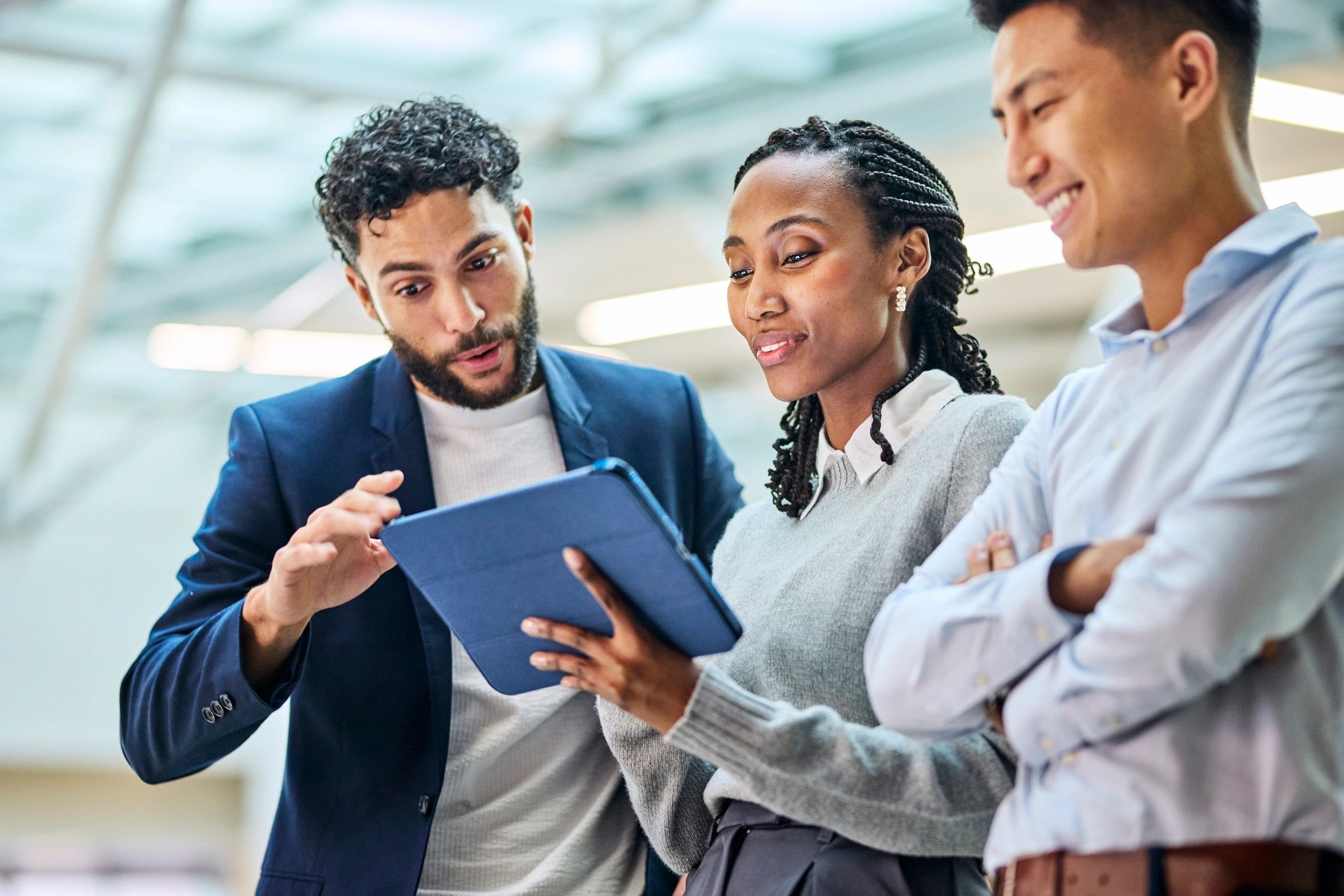 Business team reviewing cybersecurity data on a tablet