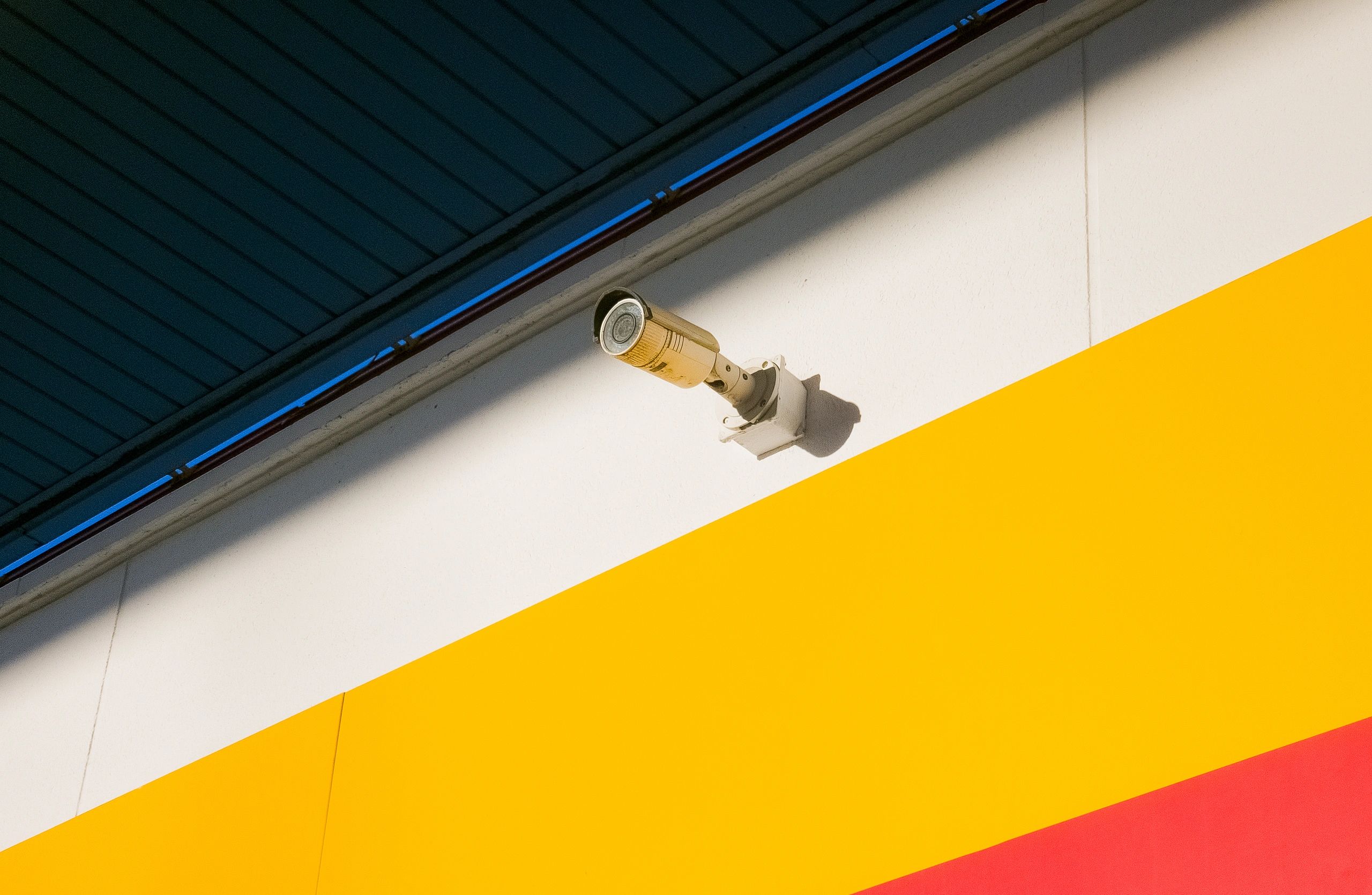 Security camera mounted on a building exterior for business surveillance